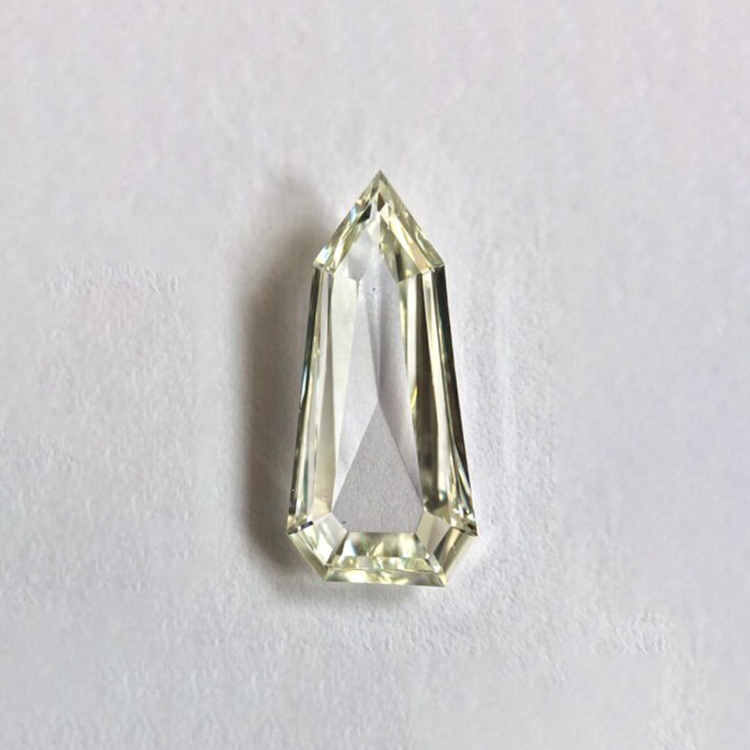 shield shape J color step cut diamond