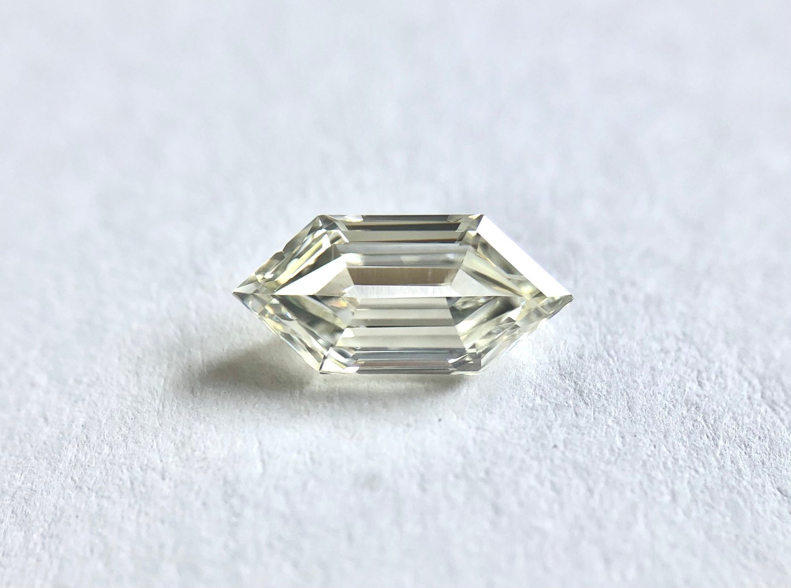Elongate Hexagon shape J Color Step Cut Diamond