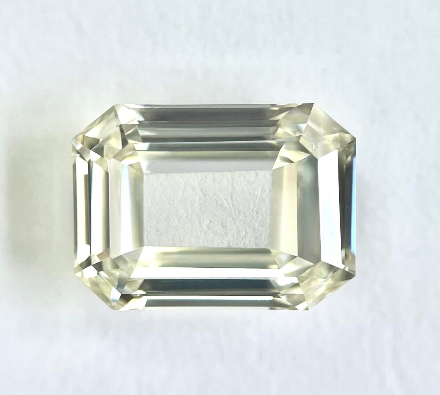 emerald shape K color portrait step cut diamond